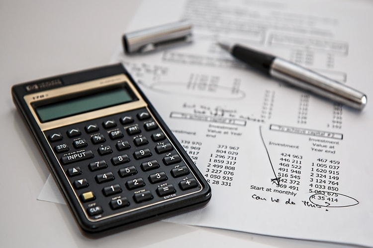 calculator on top of financial statement