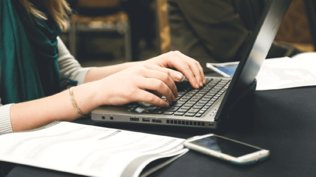 Women typing on a laptop