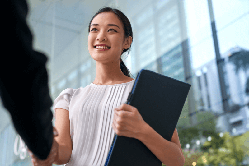 smiling woman shaking hands