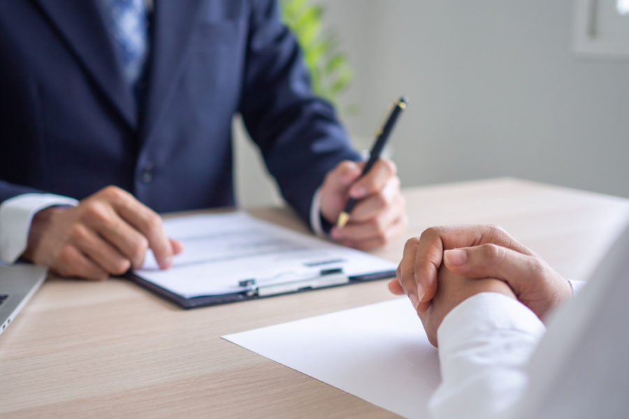 male recruiter interviewing an applicant