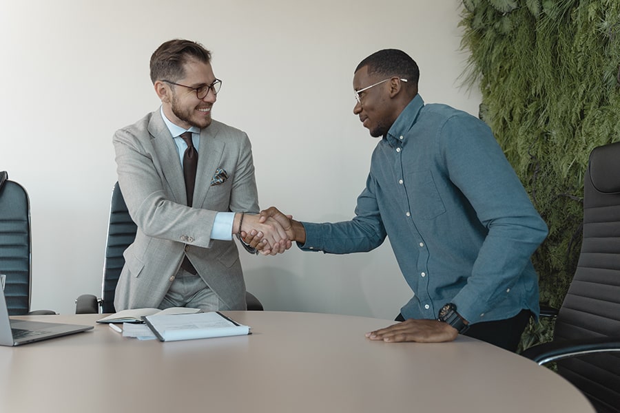 two men shaking hands